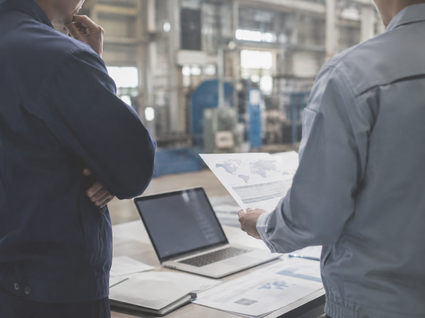 Industrial business team reviewing overseas market information